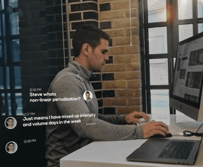 Man working at desk with chat overlay